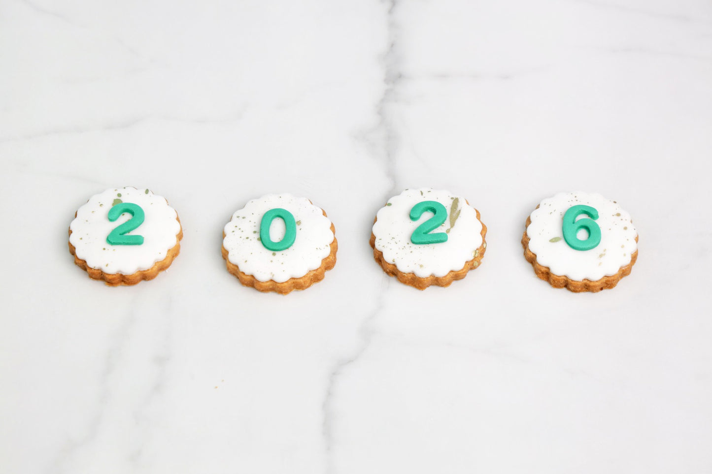2026 New Year cookies set of 4 with white icing and edible number design by Dreamy Delight by Sidra