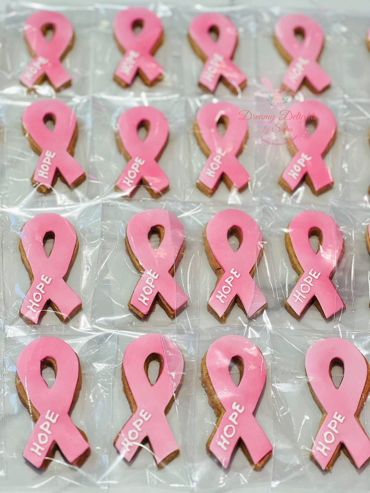 Breast Cancer Awareness Cookies Dubai with pink ribbon design by Dreamy Delights by Sidra