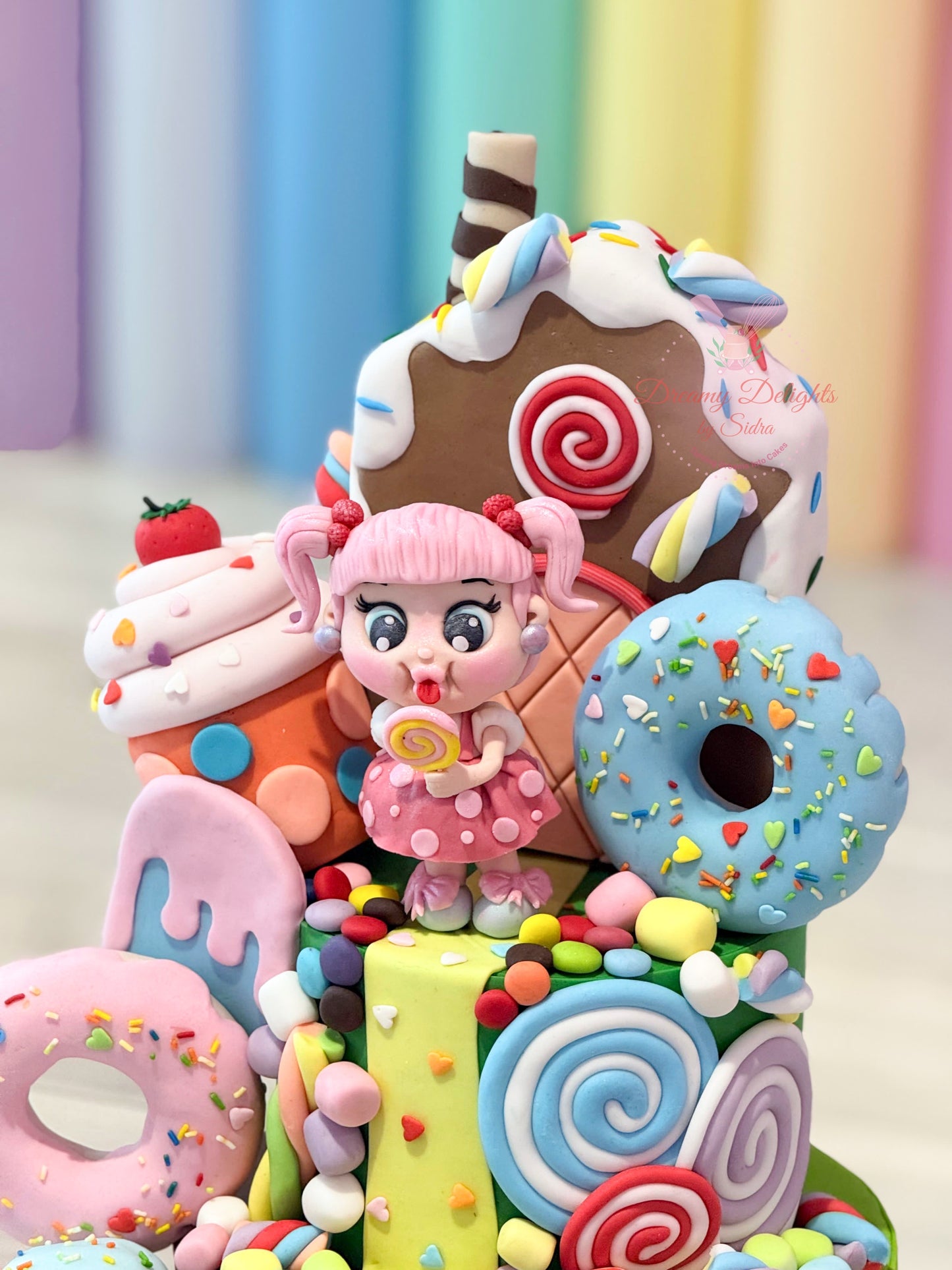 Colorful candy-themed phone case with a character holding a lollipop against a pastel curtain background.