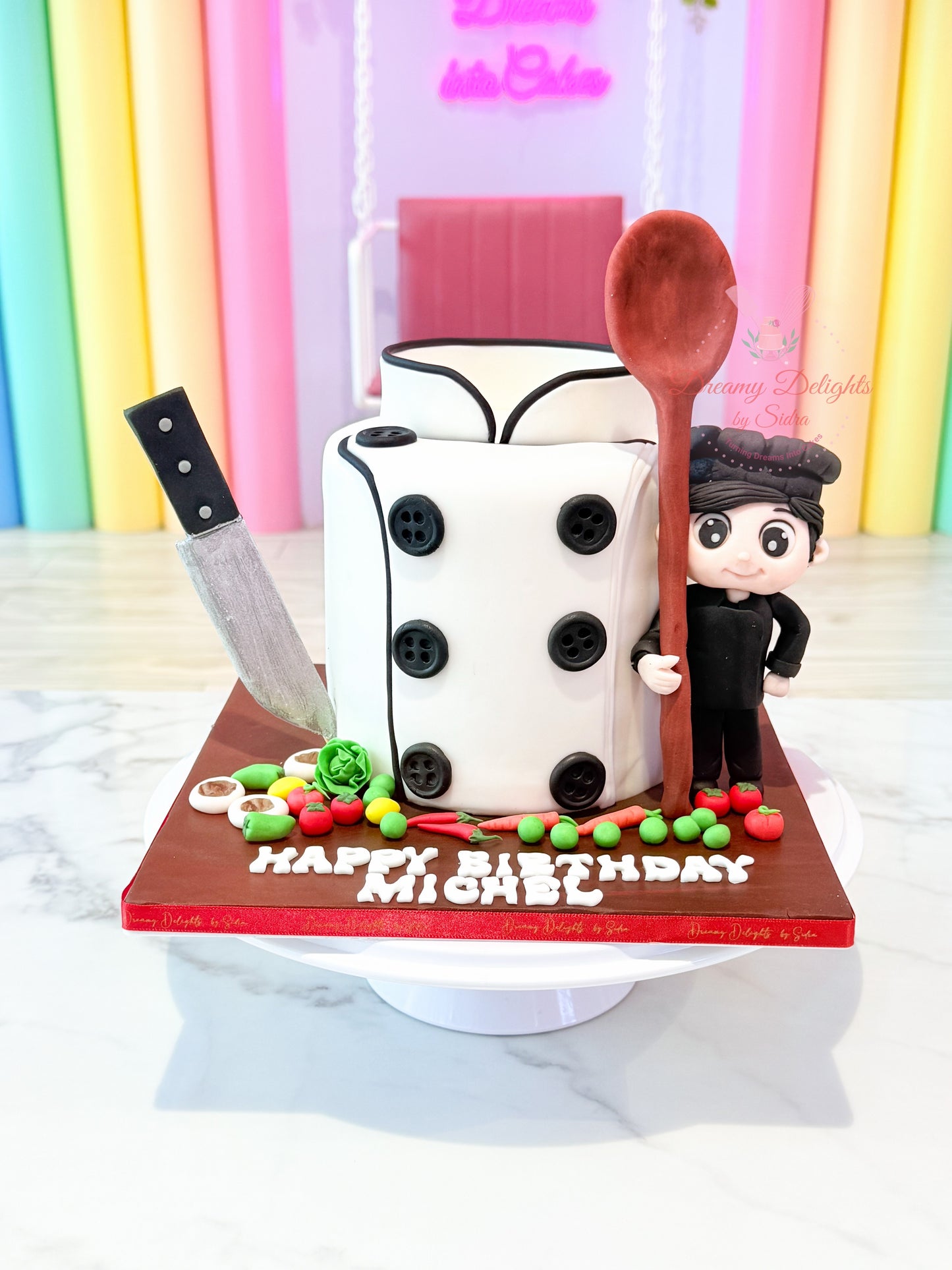 Cake with a character figurine, knife, and spoon on a colorful background