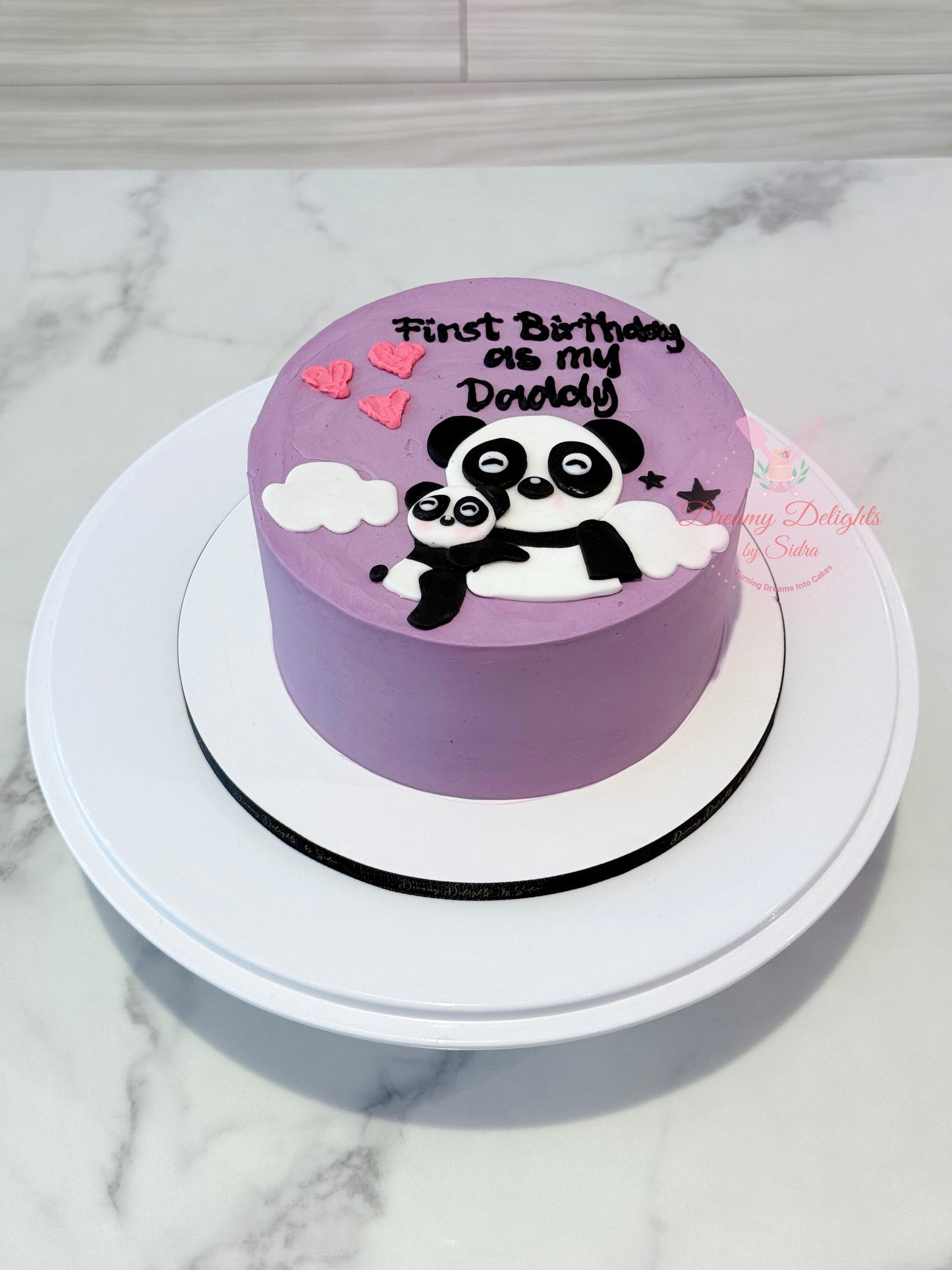 Daddy panda bento cake with cute panda illustration for first birthday and baby milestone celebrations in Dubai
