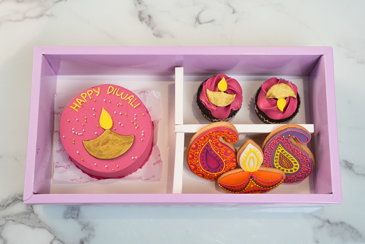 Pink Diwali diya bento cake bundle with 2 cupcakes and 3 festive cookies by Dreamy Delights by Sidra in Dubai