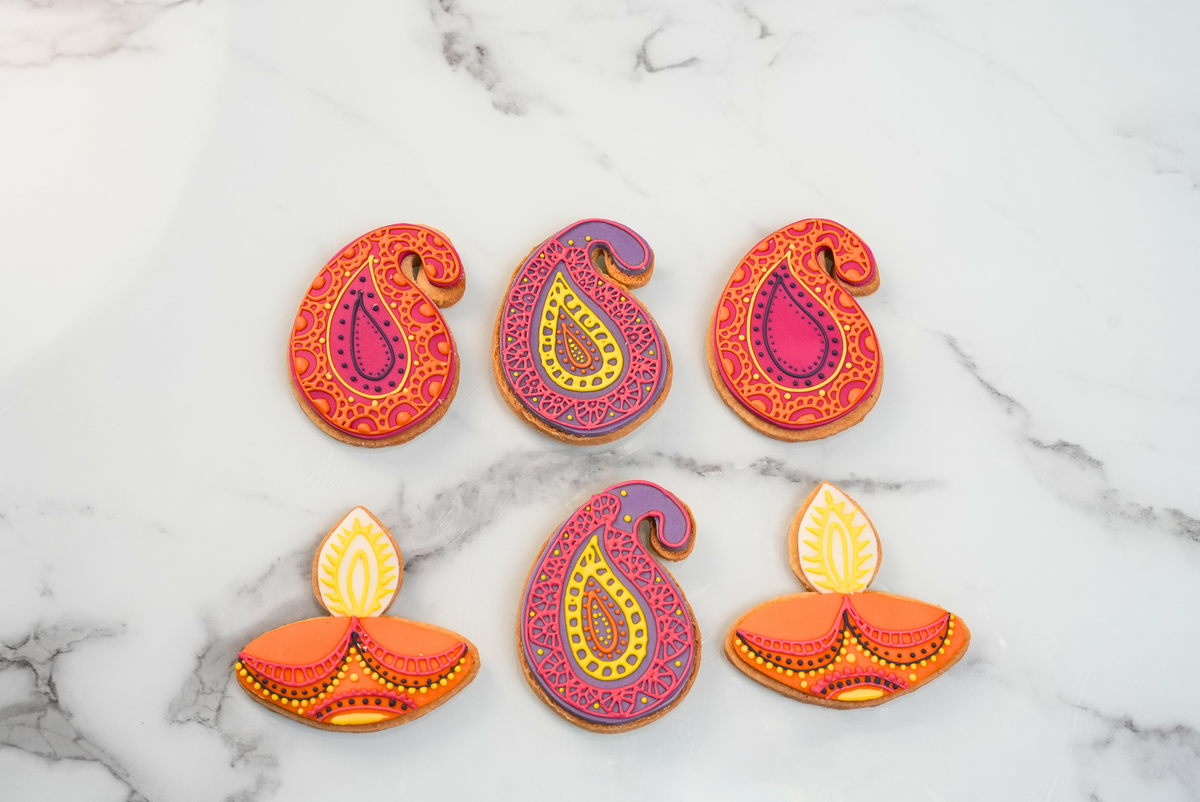 Diwali Rangeen Cookies featuring colourful paisley patterns and diya designs by Dreamy Delights by Sidra in Dubai