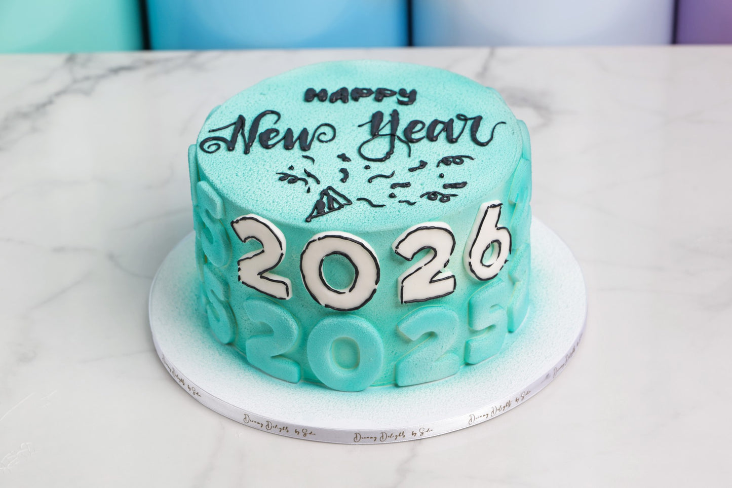Happy New Year 2026 cake with numeric detailing and textured finish by Dreamy Delight by Sidra