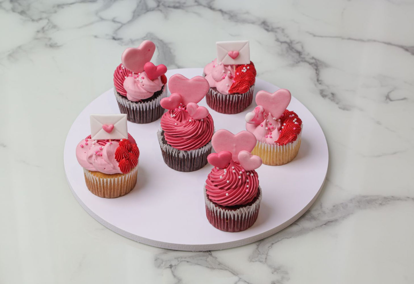 Valentine’s Day love letter cupcakes with heart and envelope decorations by Dreamy Delight by Sidra