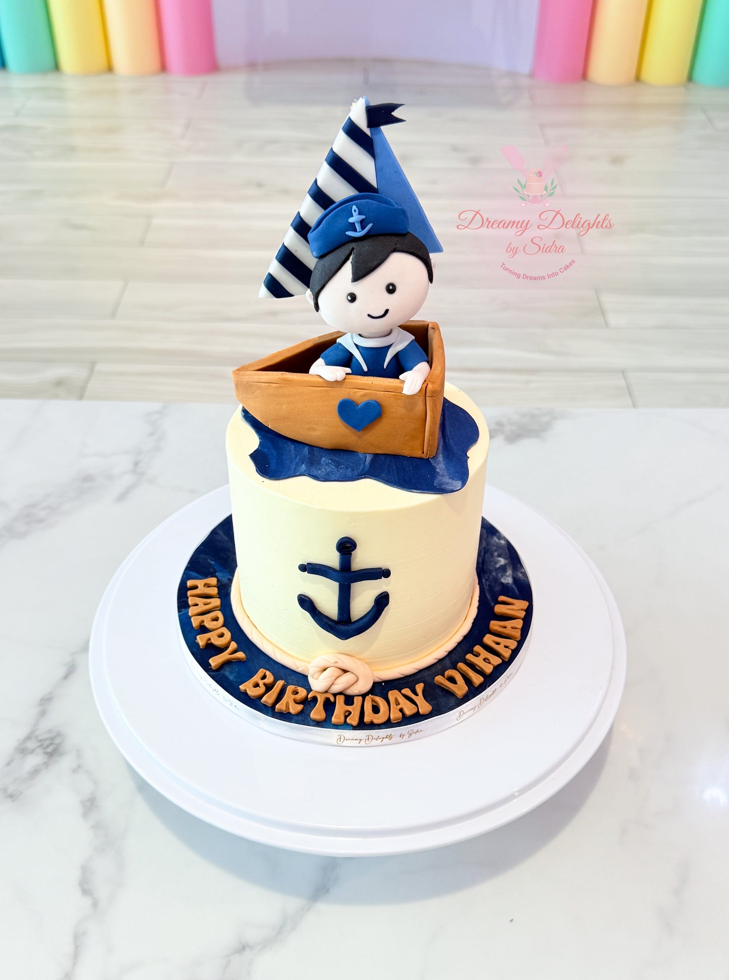 Order a sailor boy cake in Dubai for boys birthdays. Custom theme cake with nautical design, handcrafted details, and fresh baking.