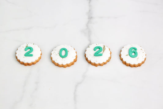 2026 New Year cookies set of 4 with white icing and edible number design by Dreamy Delight by Sidra