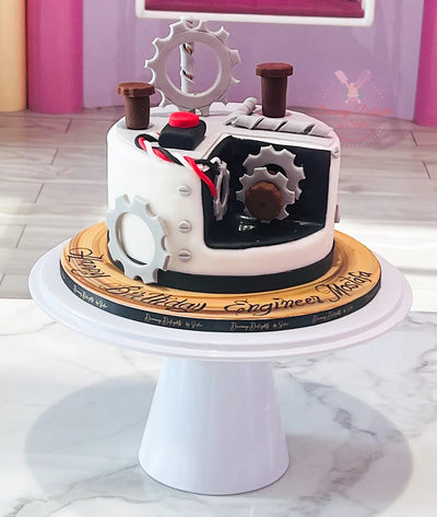 Engineering graduation cake Dubai — custom cake with hard hat and blueprint for engineering graduate by Dreamy Delights by Sidra