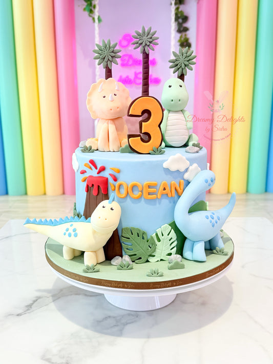 Dinosaur-themed birthday cake with number '3' against a colorful curtain background