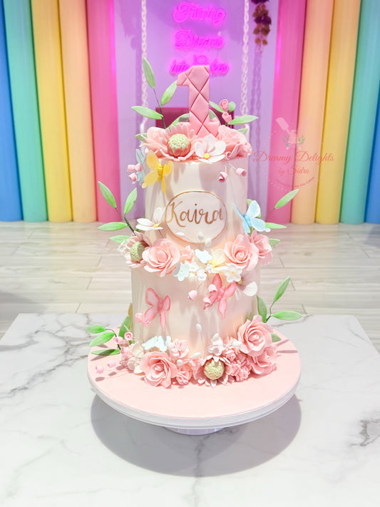 Decorative cake with flowers and a name on a colorful background