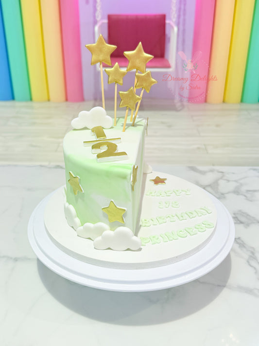 Half birthday cake with gold stars and clouds for girls kids celebration in Dubai
