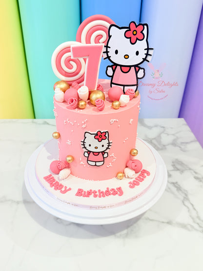 Hello Kitty birthday cake with pink decorations and a number 1 candle on a colorful background.