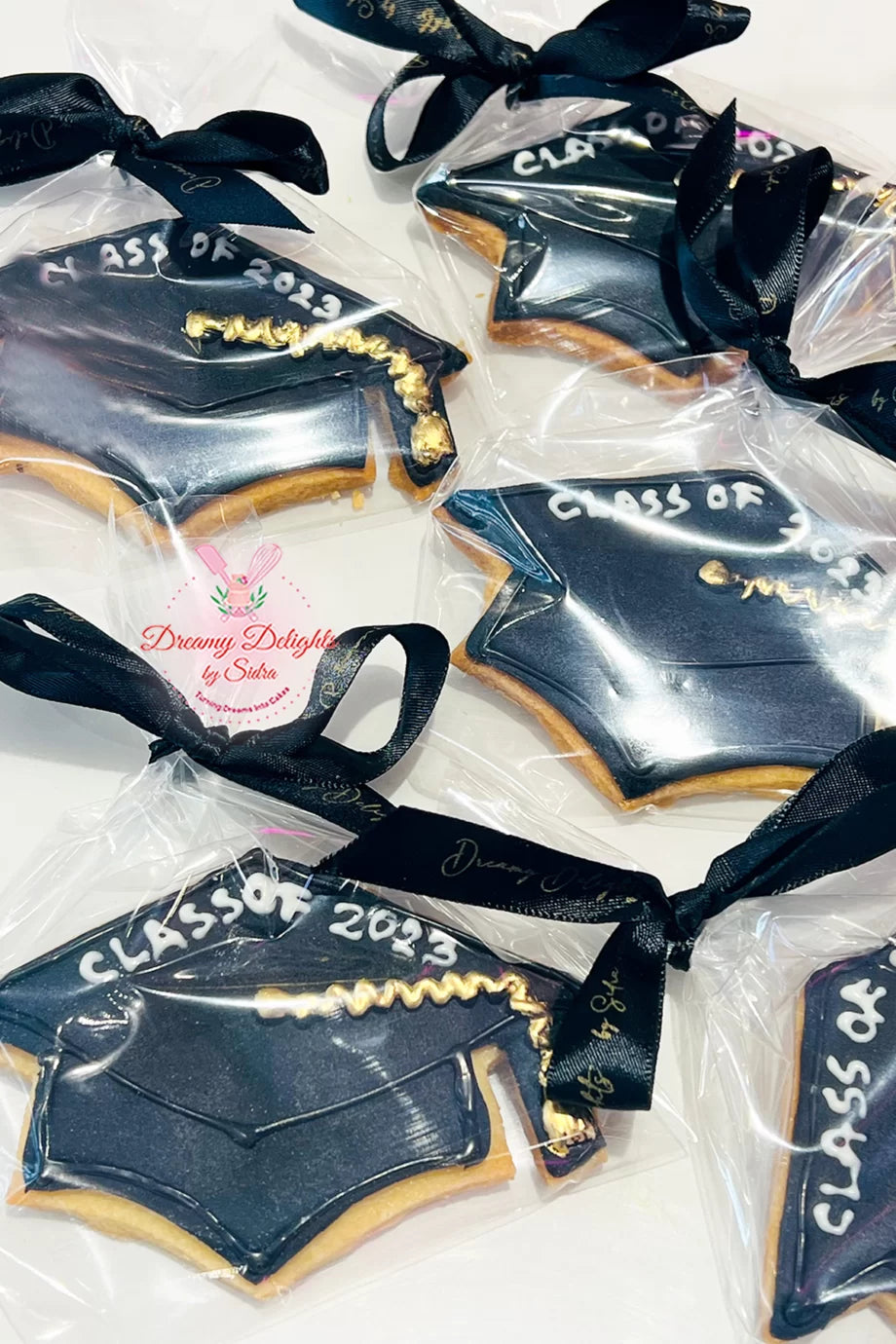 Custom graduation cookies Dubai — personalised royal icing decorated cookies for graduates by Dreamy Delights by Sidra