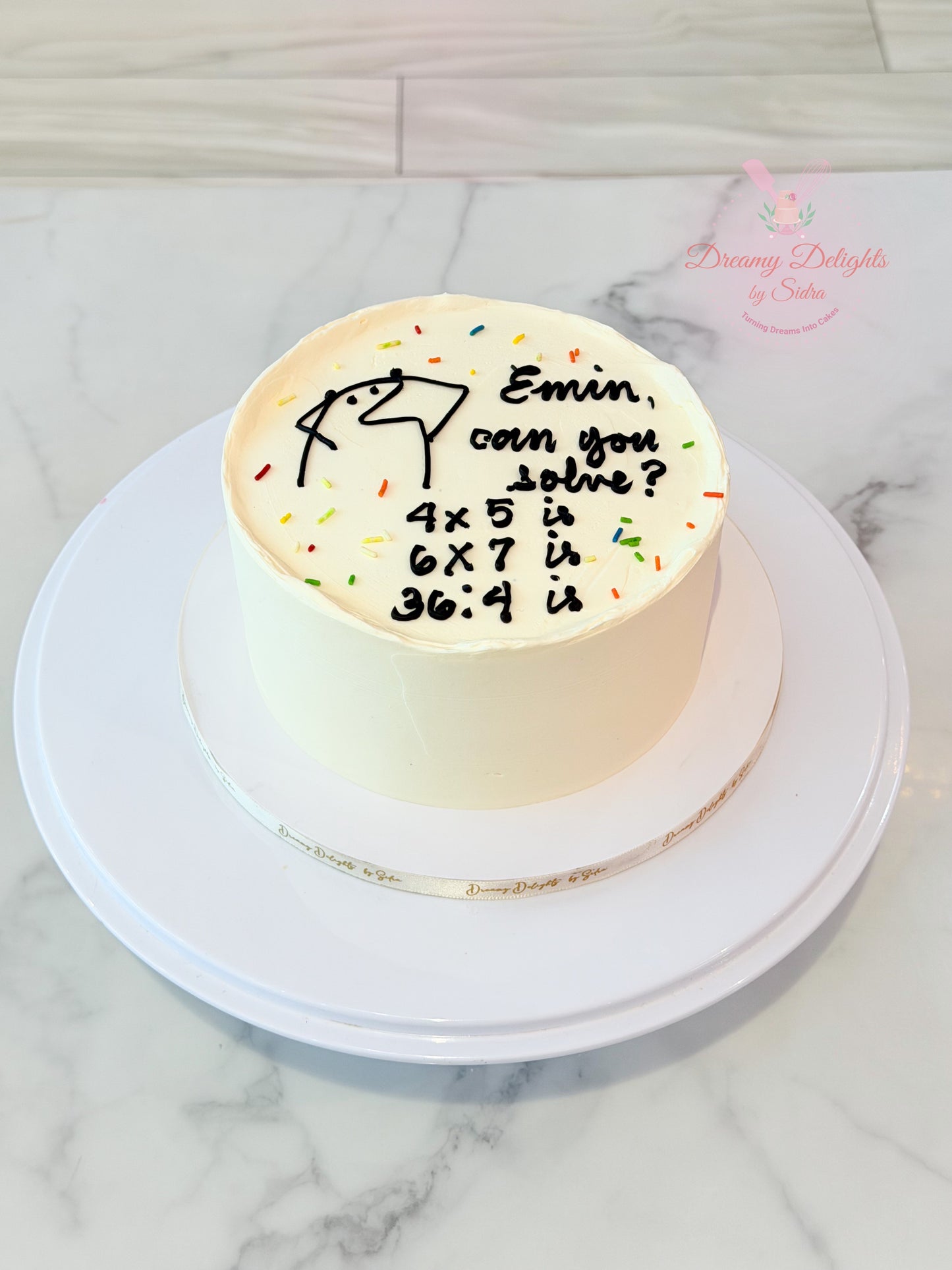 Minimalist age calculation bento cake with personalized handwritten birthday message and funny math puzzle in Dubai.