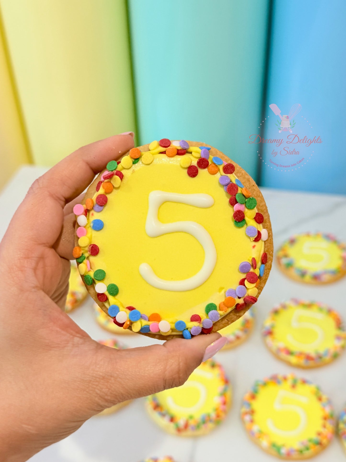 Personalized age number cookies with colorful sprinkles for birthday parties and celebrations in Dubai