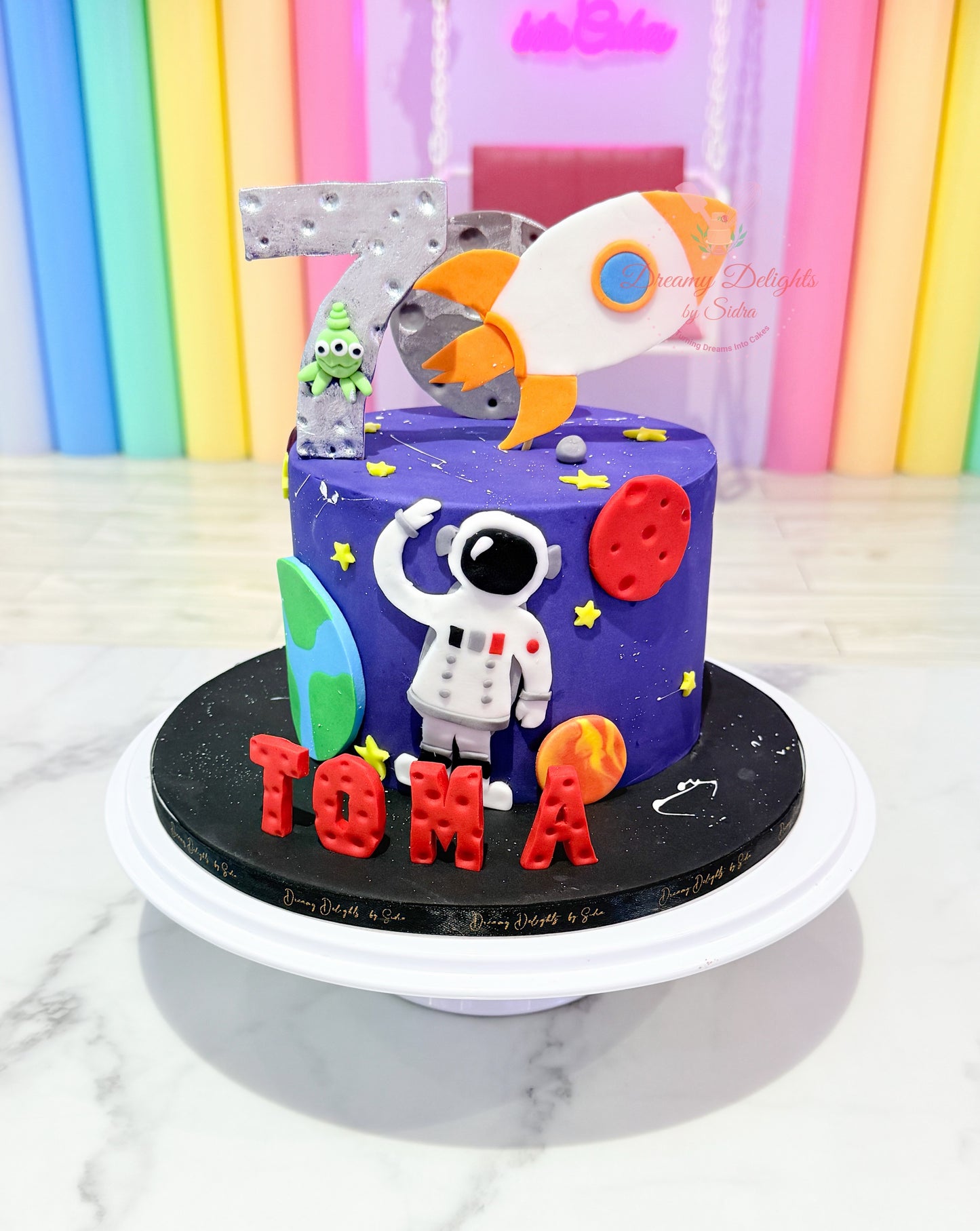 Astronaut spaceship cake with rocket and space theme design
