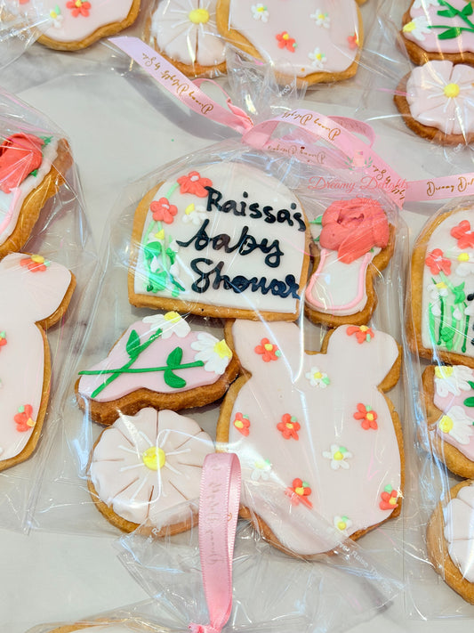 Baby shower cookie set with individually wrapped floral and baby-themed decorated cookies