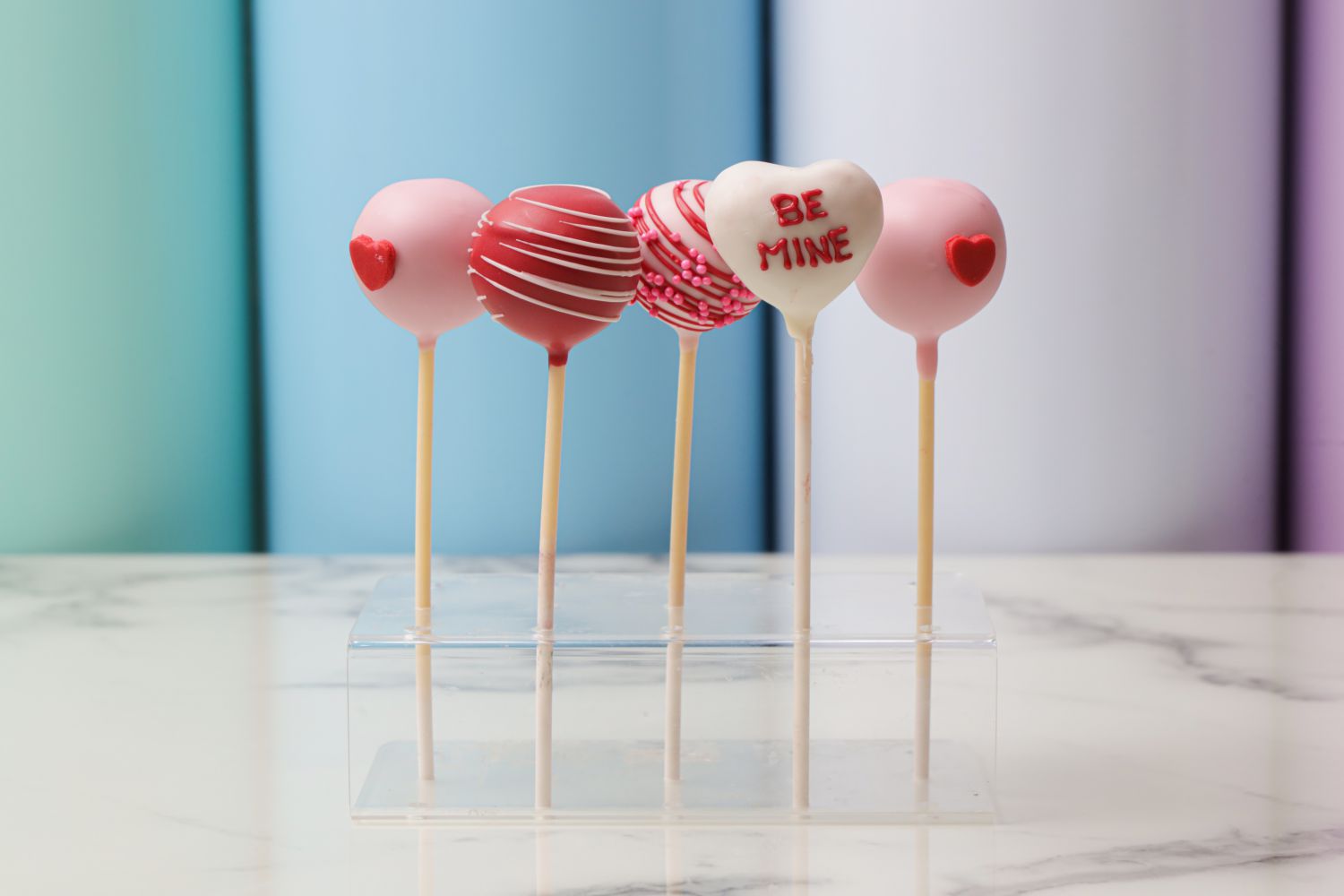 Be Mine Valentine’s Day heart cake pops with pink and red decoration by Dreamy Delight by Sidra