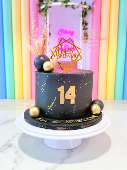 Black and gold birthday cake with modern buttercream design