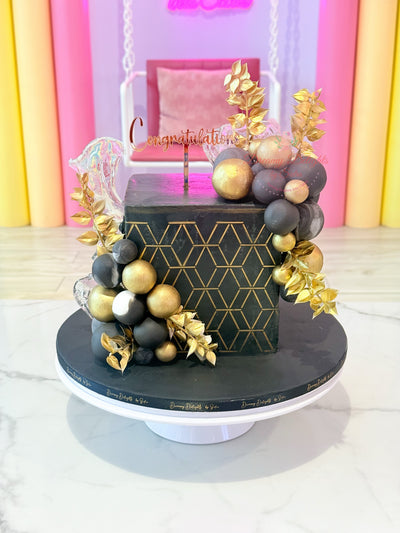 Black and gold congratulations graduation cake Dubai — luxury celebration cake by Dreamy Delights by Sidra