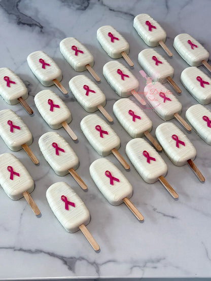Breast Cancer Awareness Cakesicles Dubai with pink decoration by Dreamy Delights by Sidra
