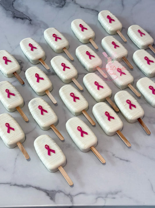 Breast Cancer Awareness Cakesicles Dubai with pink decoration by Dreamy Delights by Sidra
