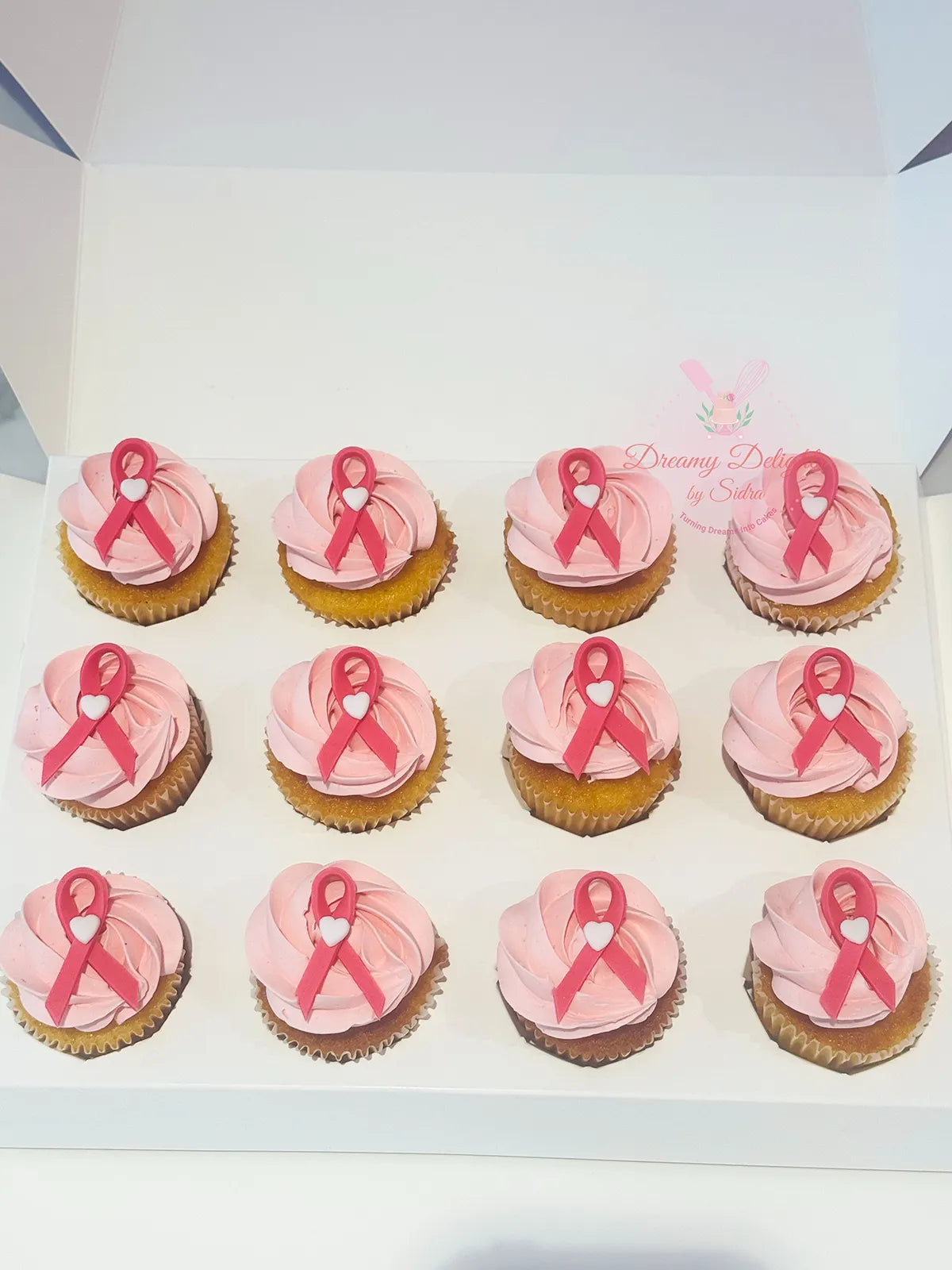 Breast Cancer Awareness Cupcakes Dubai with pink ribbon decoration by Dreamy Delights by Sidra