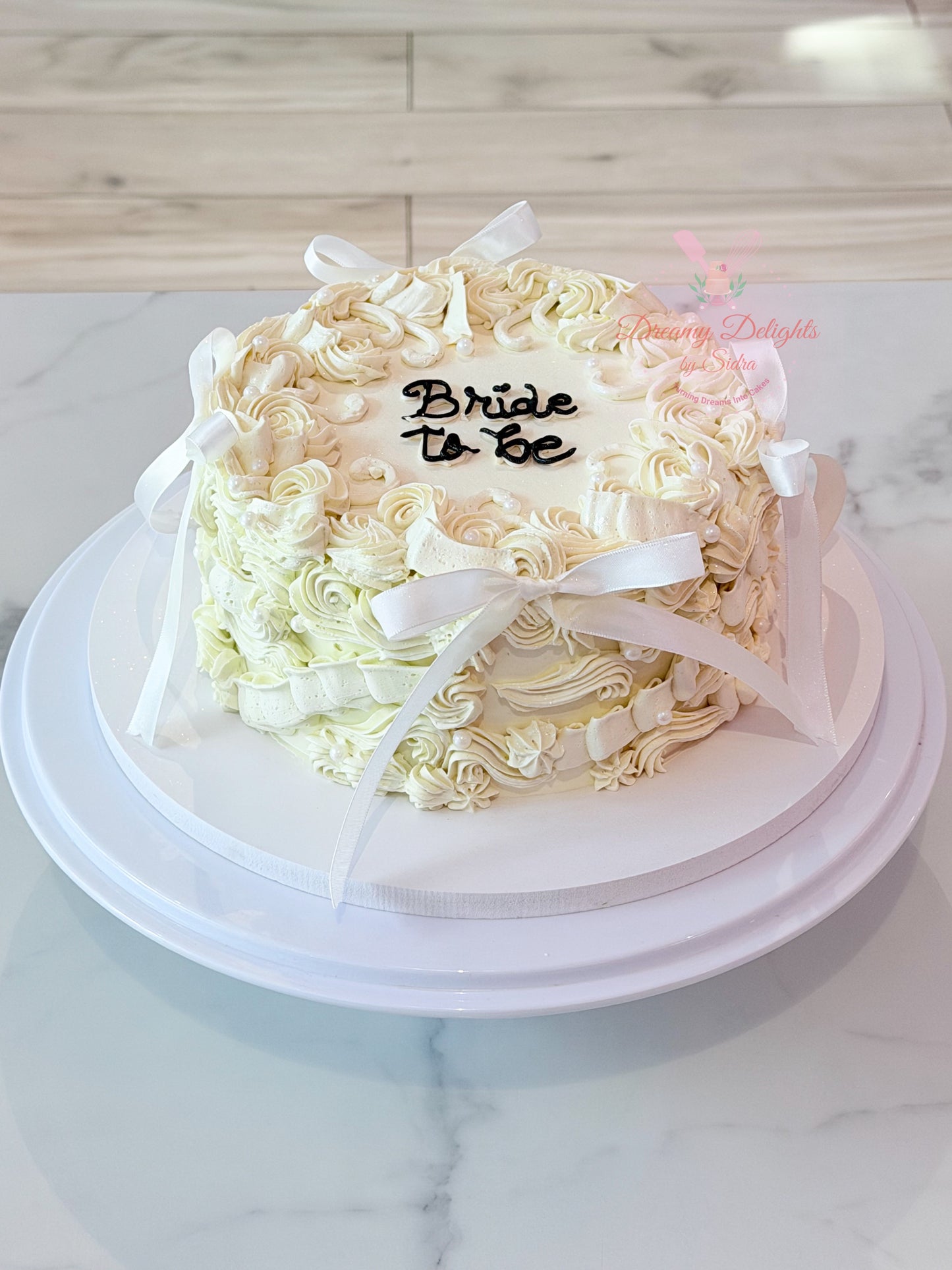 Bride to Be Cake with vintage buttercream piping and satin bows for bridal shower celebrations in Dubai