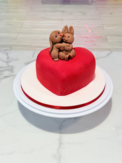 Bunny couple heart anniversary cake with romantic fondant design in Dubai