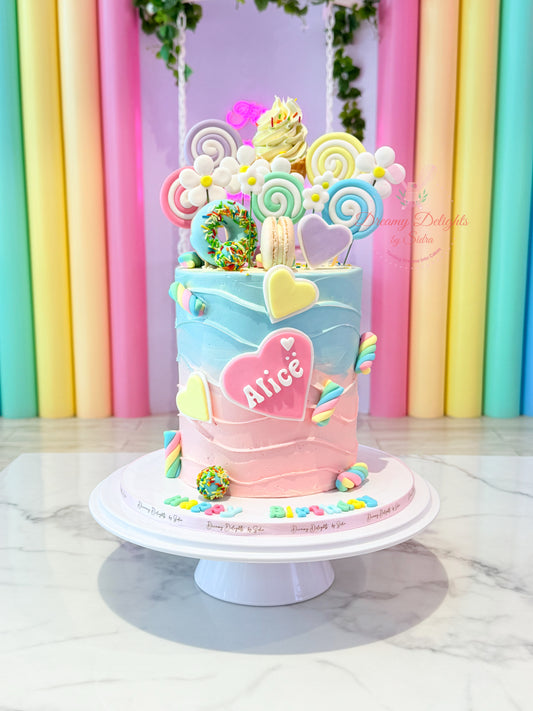 Colorful birthday cake with decorative elements on a marble surface and pastel curtain background.