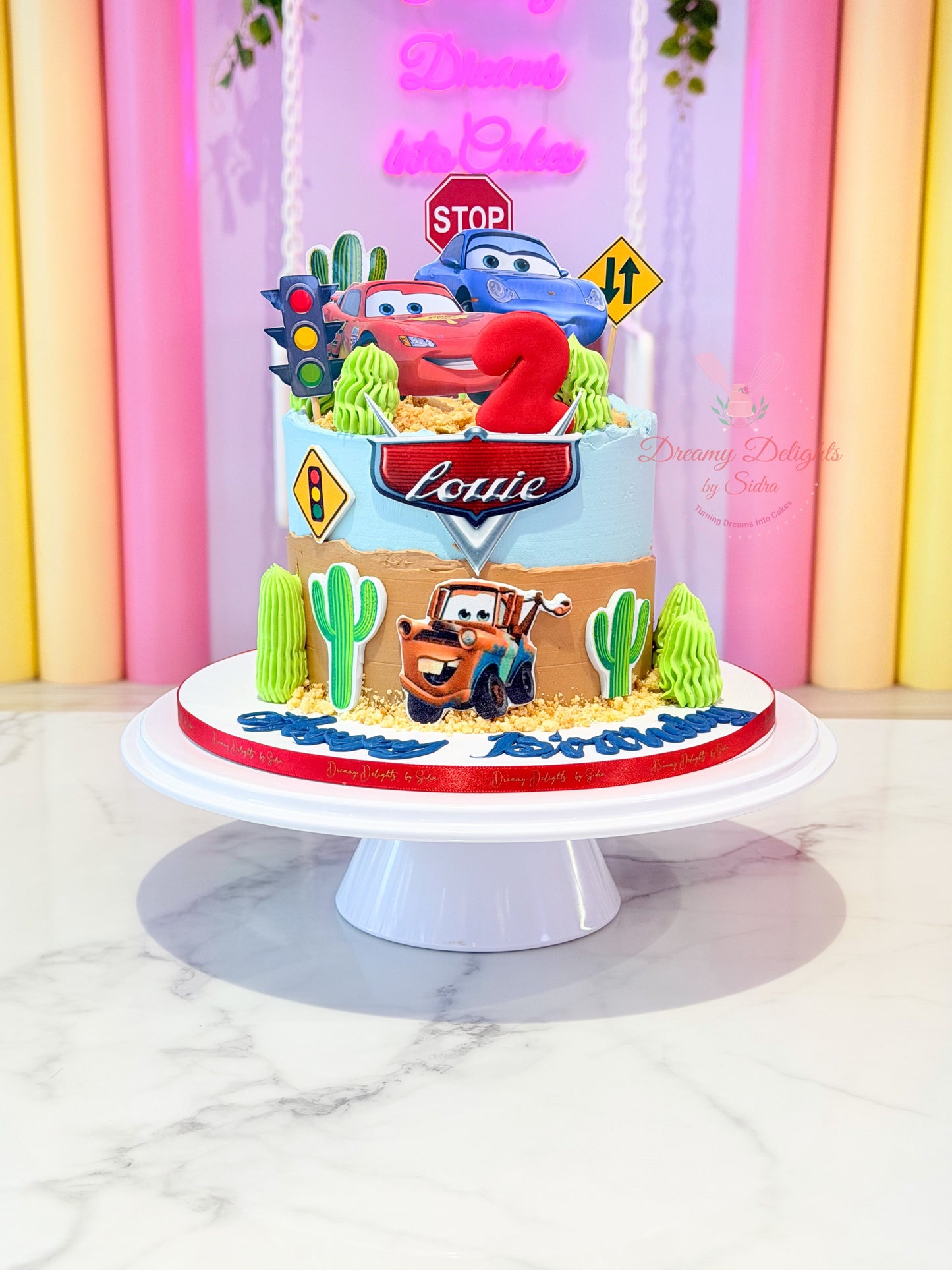Cars theme birthday cake with Lightning McQueen decorations in Dubai