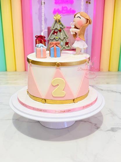 Christmas birthday girl cake with festive decorations and custom age topper in Dubai