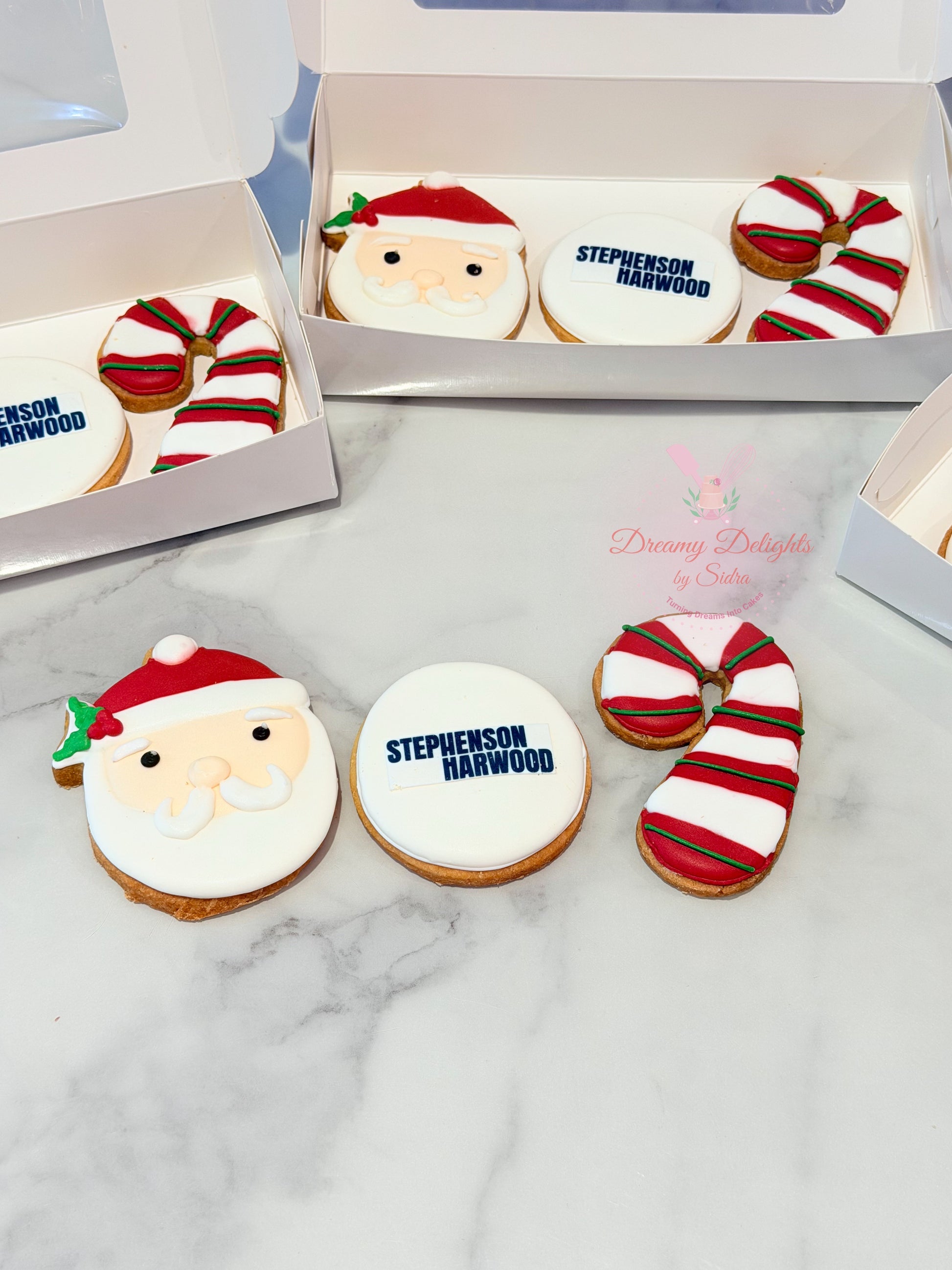 Christmas corporate gifting cookies set with Santa cookie, company logo cookie, and candy cane cookie in Dubai