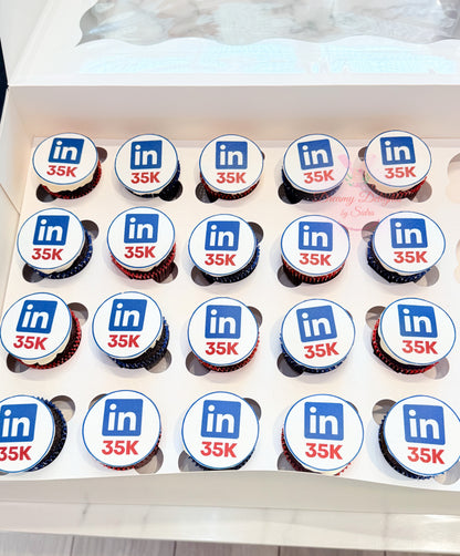 Corporate achievement cupcakes with custom branded edible toppers for office celebrations in Dubai
