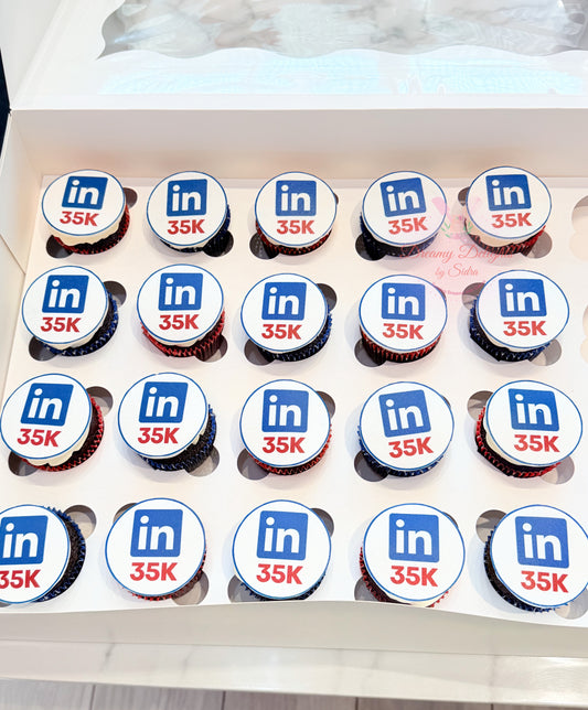 Corporate achievement cupcakes with custom branded edible toppers for office celebrations in Dubai