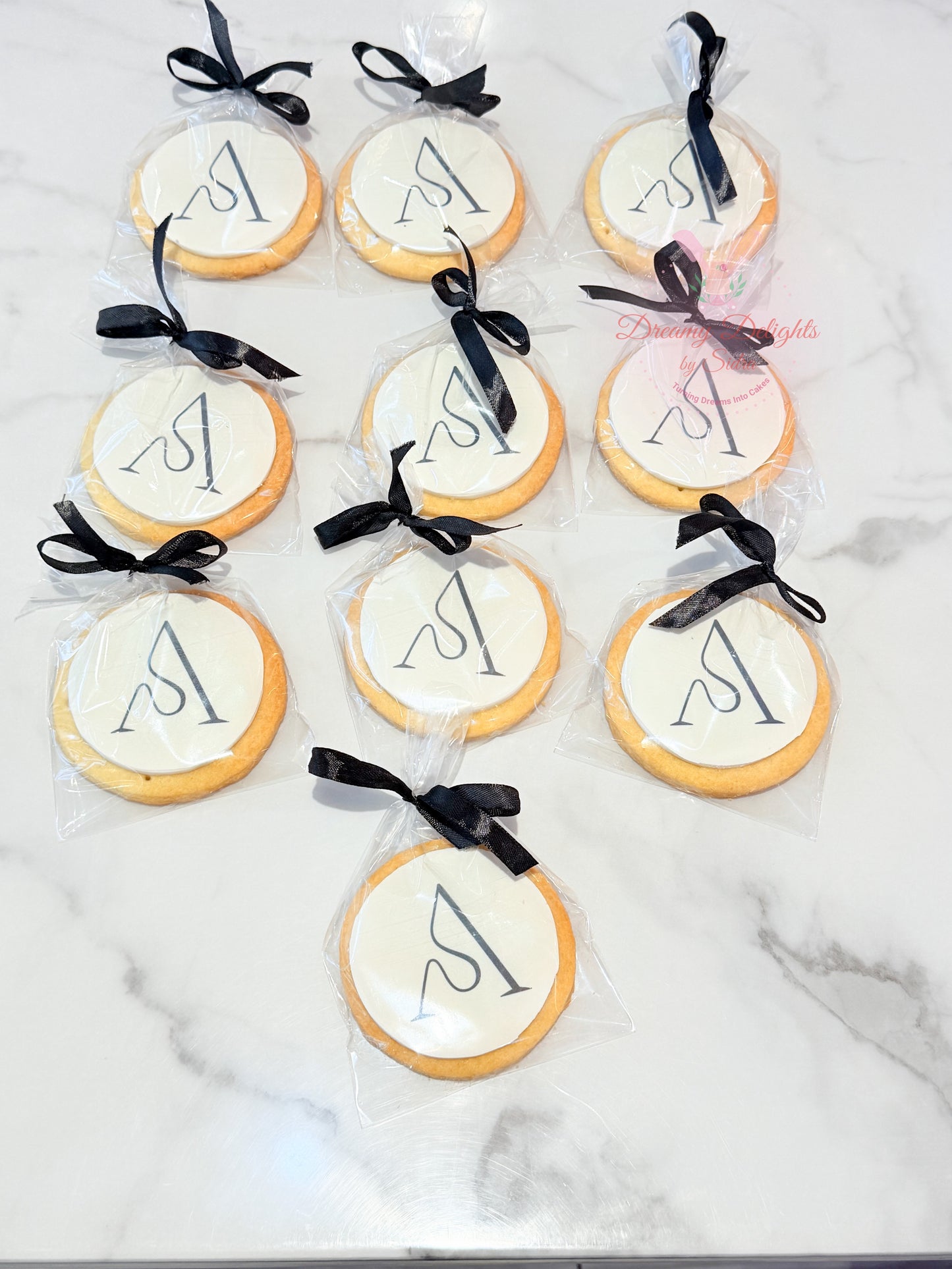 Corporate logo cookies individually packed with ribbon for branded event gifting in Dubai