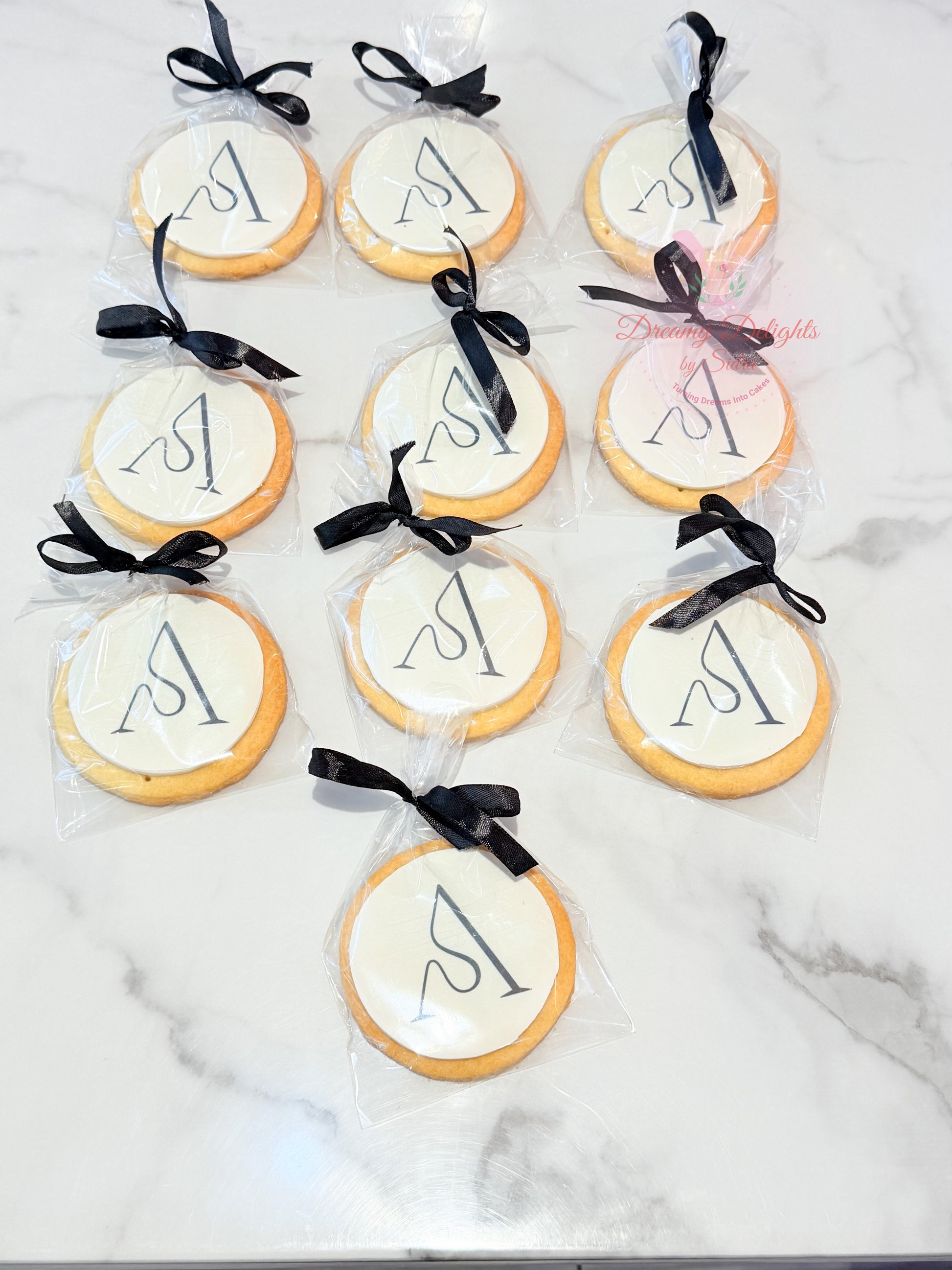 Corporate logo cookies individually packed with ribbon for branded event gifting in Dubai