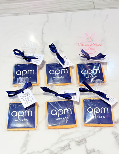 Personalized corporate logo cookies individually wrapped with ribbons and gift tags for business events and corporate gifting in Dubai.