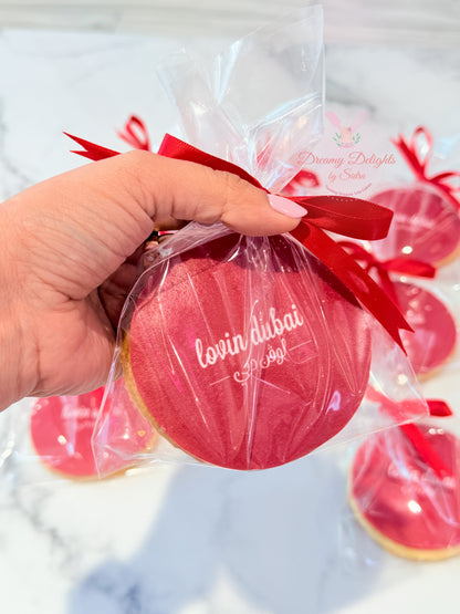 Custom corporate logo cookies with branded edible print and ribbon packaging in Dubai