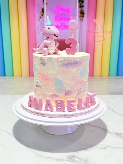 Cute Girl Dinosaur Cake with pastel dinosaur topper, customized kids birthday cake for girls in Dubai