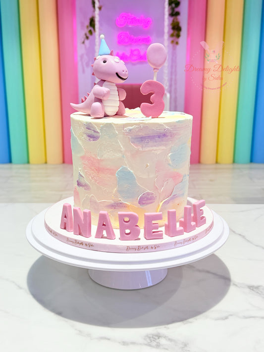 Cute Girl Dinosaur Cake with pastel dinosaur topper, customized kids birthday cake for girls in Dubai