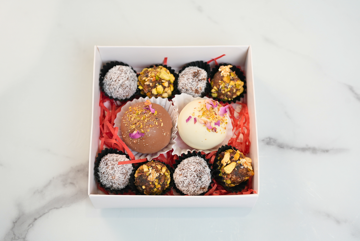 Diwali energy balls gift box with chocolate truffles, pistachio date balls and coconut date balls by Dreamy Delights by Sidra in Dubai