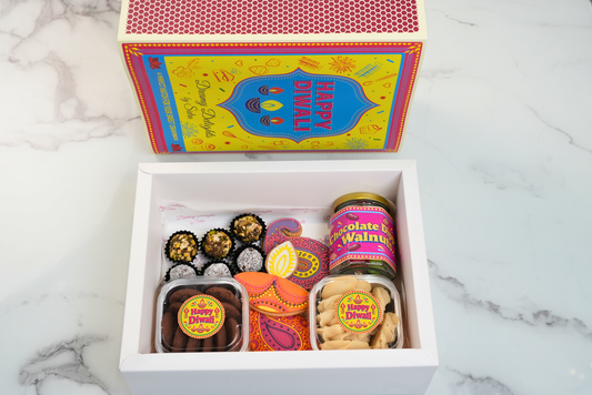 Diwali gift box Dubai with festive cookies, date balls and chocolate walnuts by Dreamy Delights by Sidra