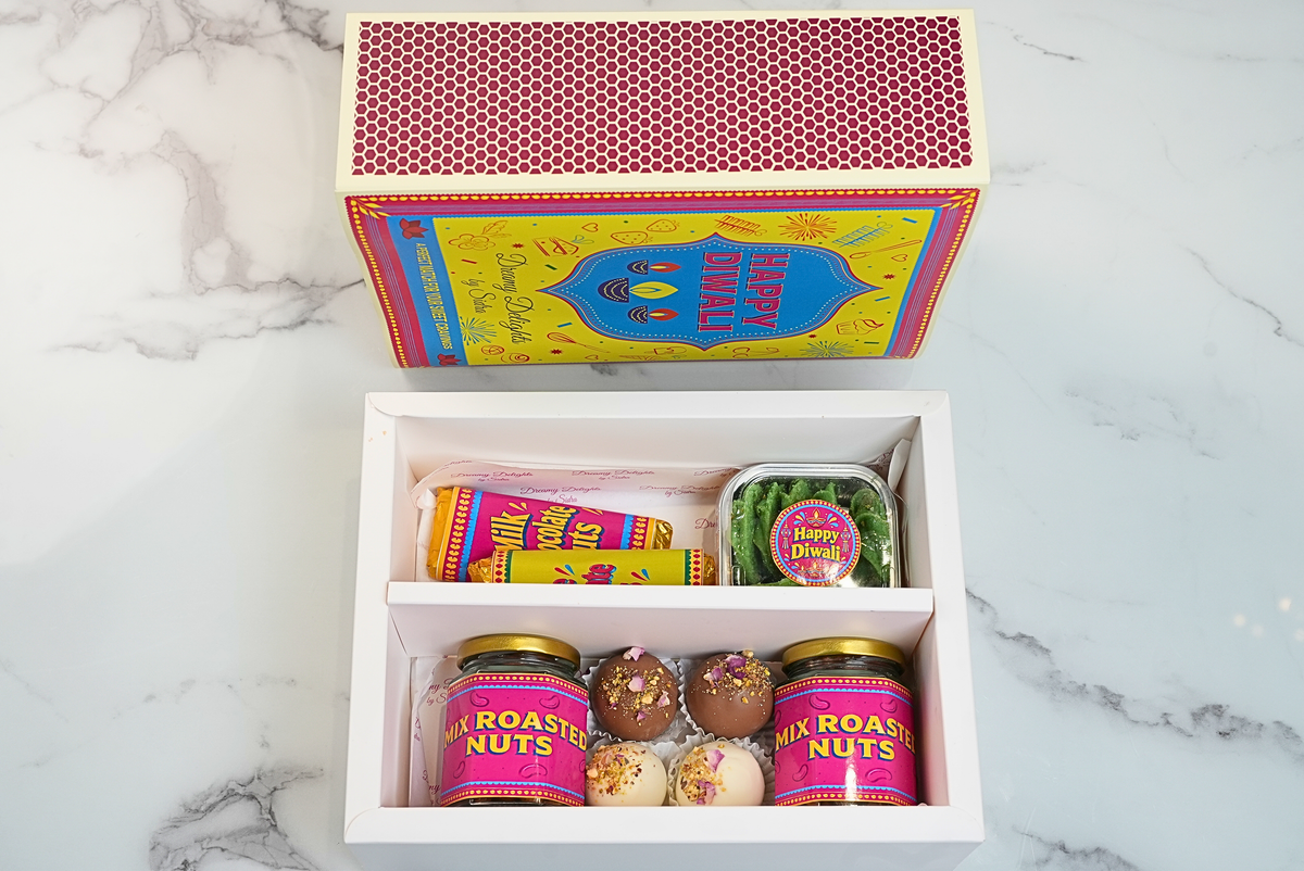 Diwali nutty chocolate gift hamper with chocolate bars, Sable cookies, roasted nuts and truffles by Dreamy Delights by Sidra in Dubai