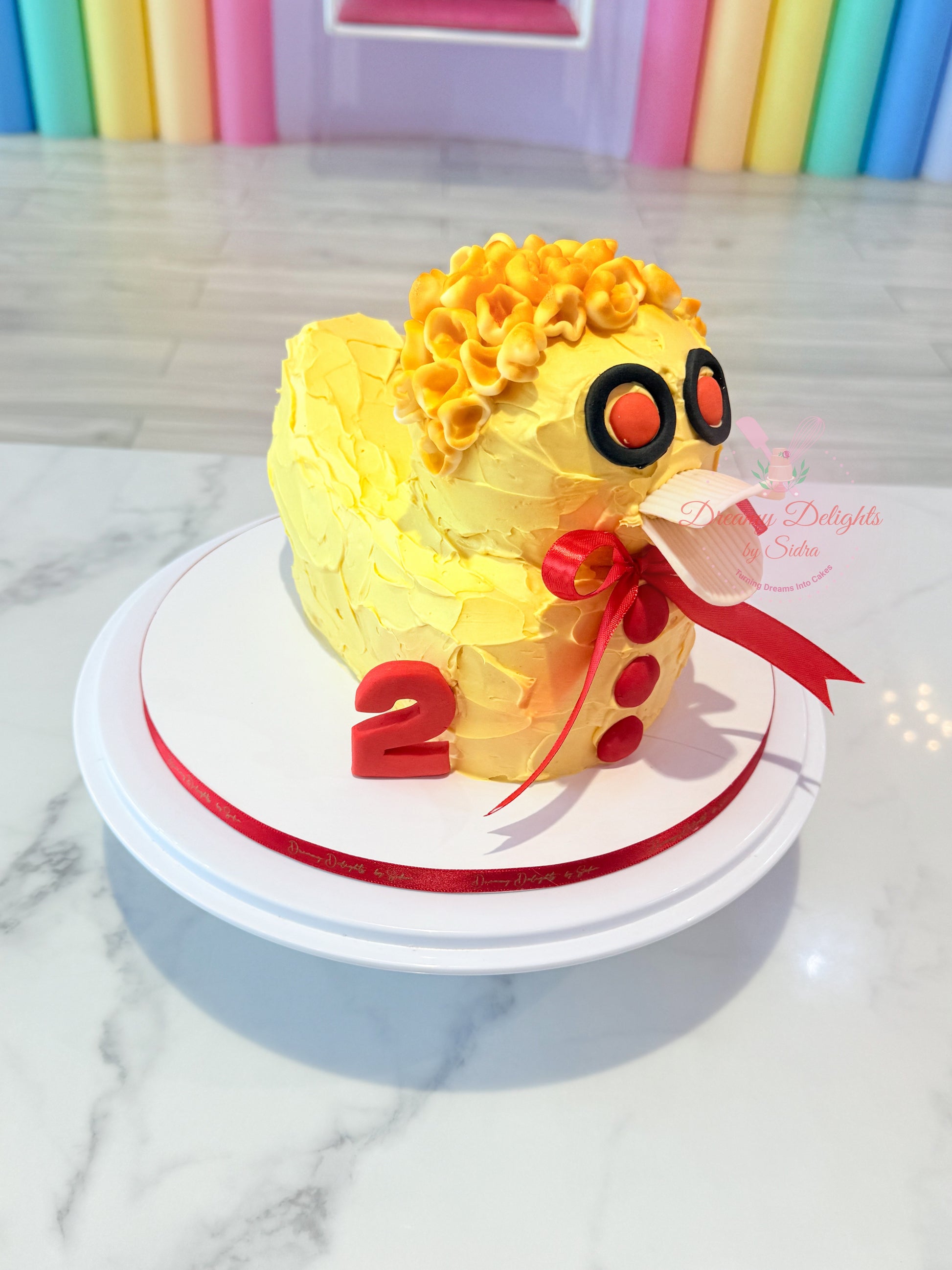 Duck birthday cake for kids and boys with yellow theme and custom age topper in Dubai