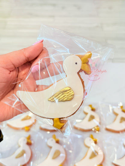 Hand-decorated duck themed custom sugar cookie with white icing and gold wing detail in Dubai