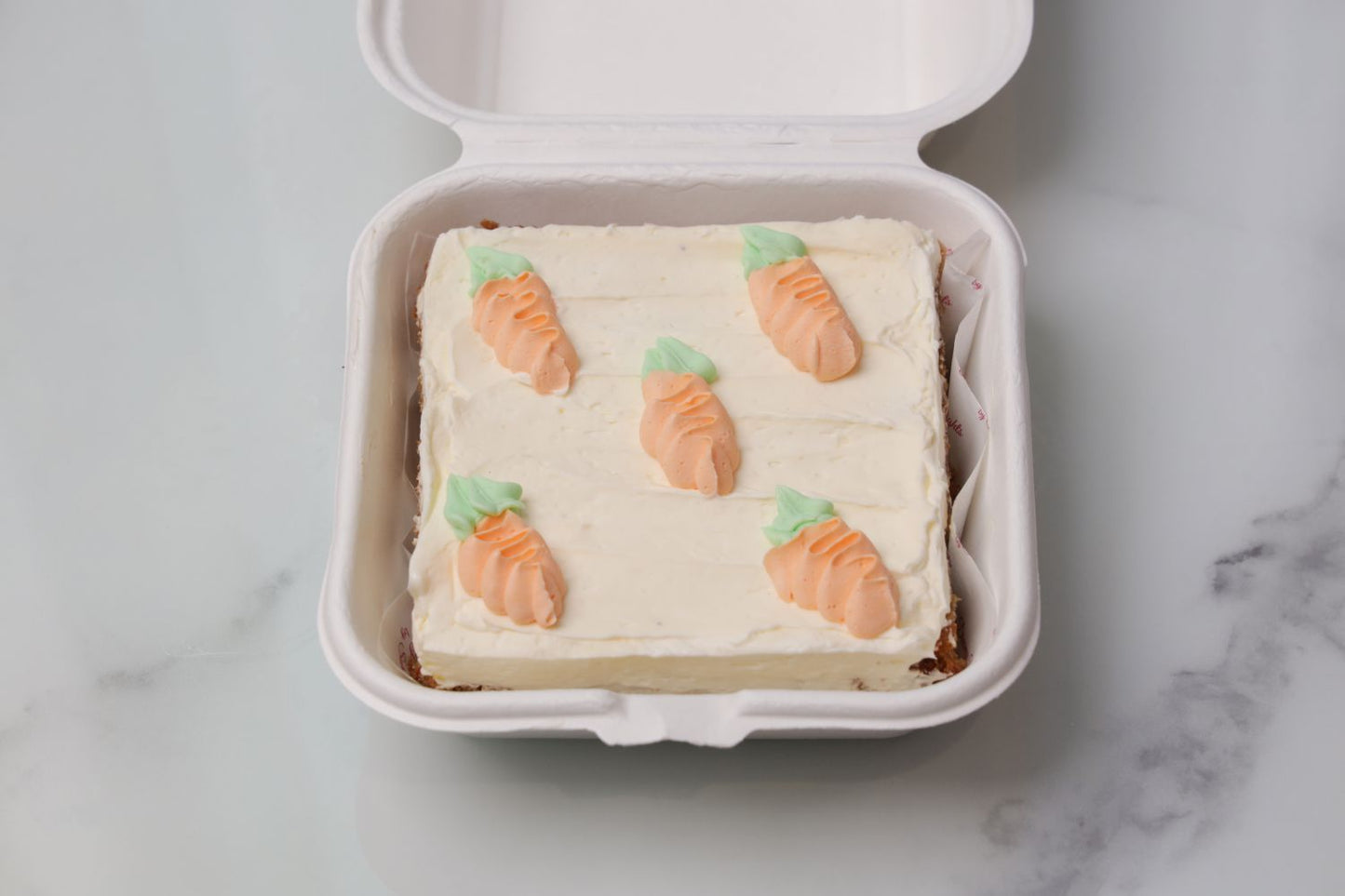 Easter bento cake Dubai with carrot design and cream frosting