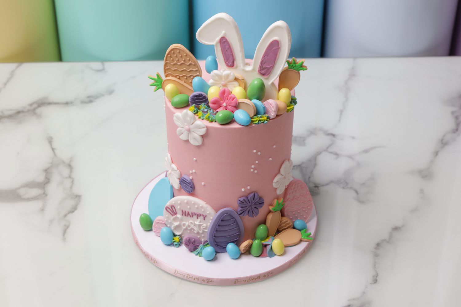 Easter bunny cake Dubai with rabbit ears and colorful Easter eggs