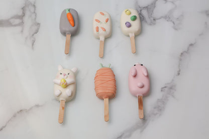 Easter cakesicles Dubai with bunny and carrot themed chocolate coating