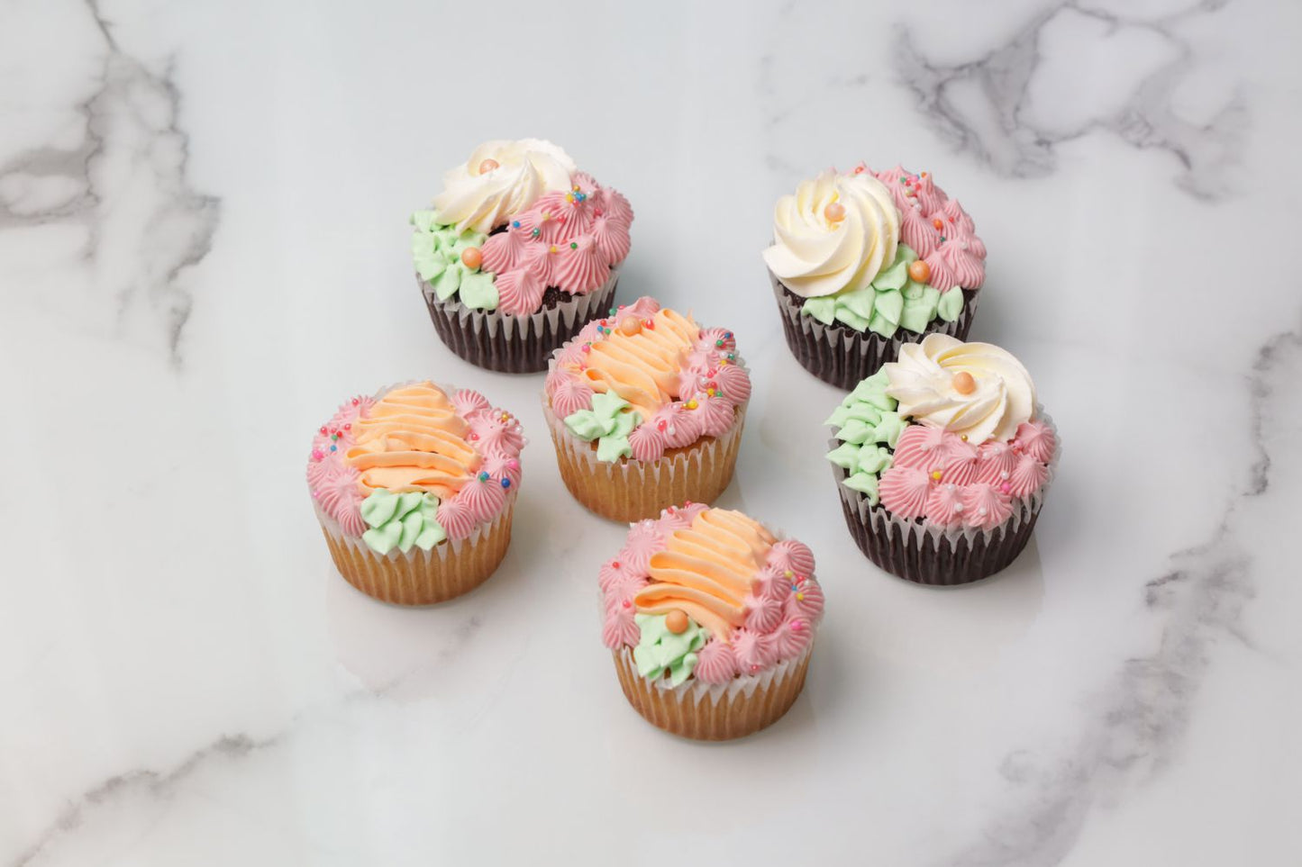 Easter cupcakes Dubai with pastel frosting and floral decoration